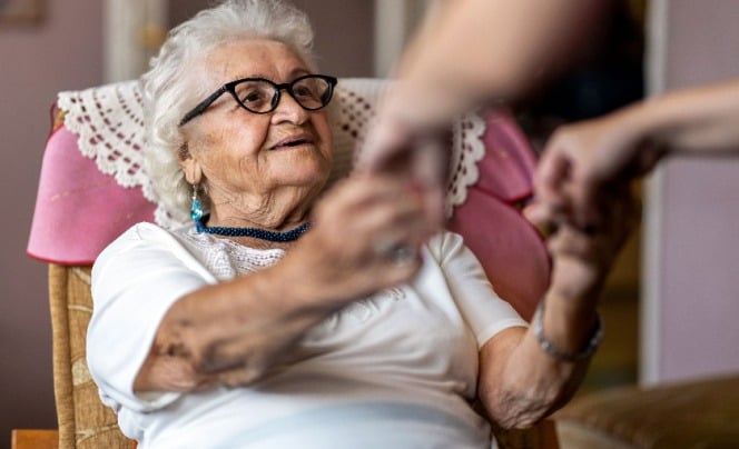 Older lady getting a helping hand